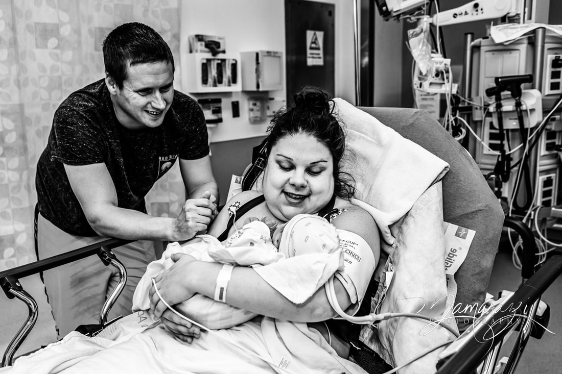 Baby studying momma's face - hospital birth in San Antonio